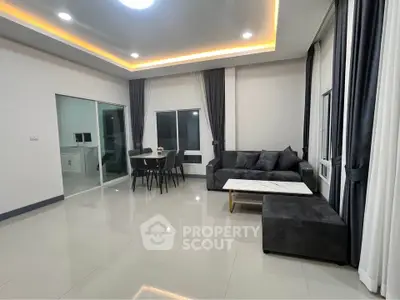 Spacious modern living room with sleek furniture and ambient lighting