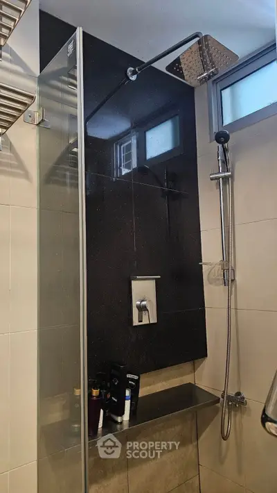 Modern bathroom with sleek shower design and glass partition