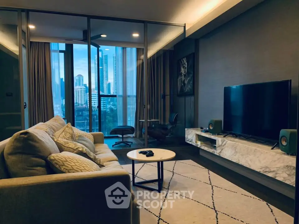 Luxurious modern living room with city view, elegant decor, and spacious seating area.