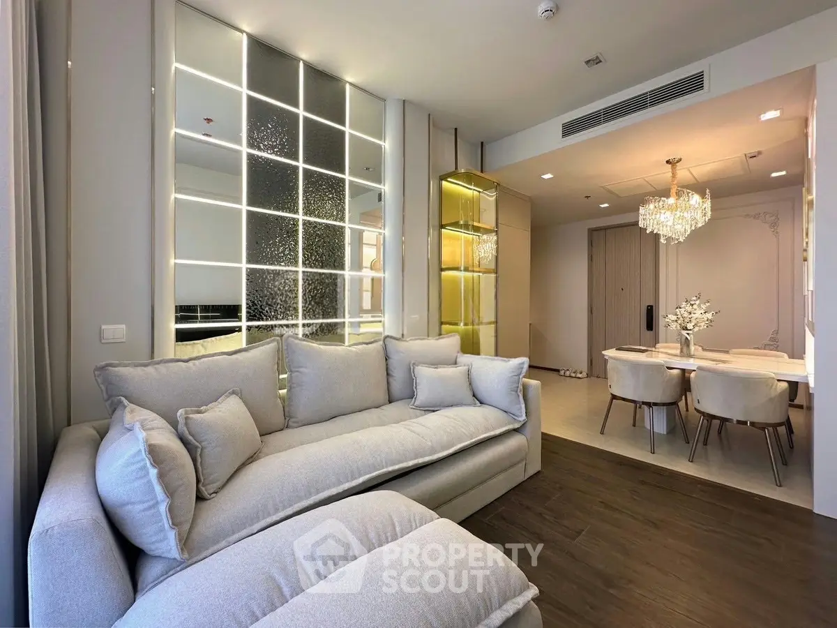 Luxurious modern living room with elegant dining area and plush seating