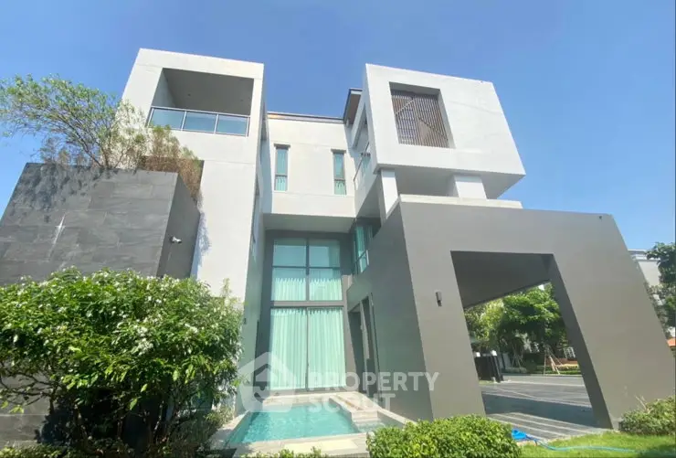 Luxurious modern villa with sleek architecture and private pool in a serene setting.