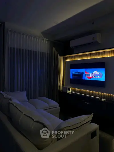 Modern living room with cozy sofa and ambient lighting