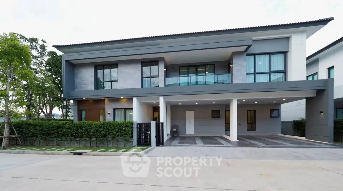 Modern two-story house with sleek design and spacious driveway