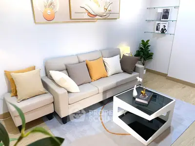 Modern living room with stylish decor, cozy sofa, and elegant coffee table in a bright, inviting space.