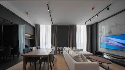 Modern living room with sleek design, large windows, and stylish furniture in a luxury apartment.