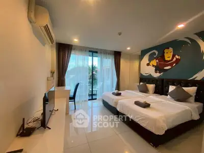 Spacious modern bedroom with twin beds and balcony access, featuring stylish decor and ample natural light.
