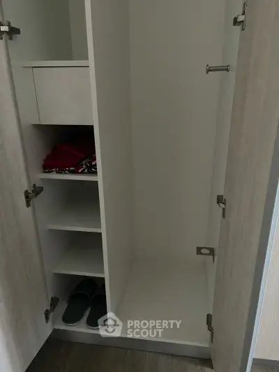 Spacious modern wardrobe with shelves and storage space in a contemporary home.