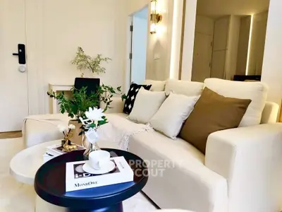 Chic modern living room with cozy white sofa and stylish decor