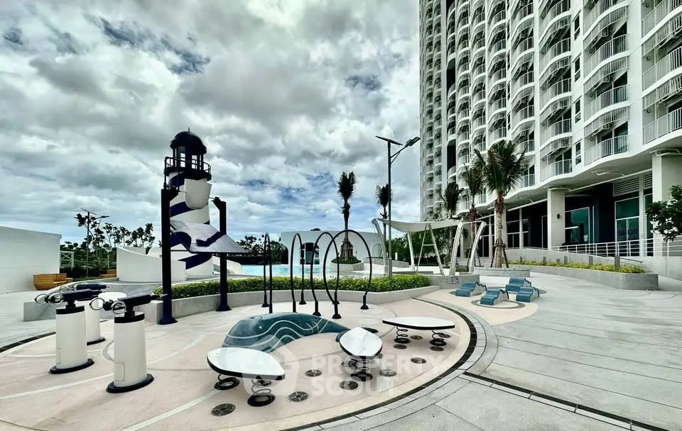 Modern high-rise building with unique outdoor recreational area and pool.