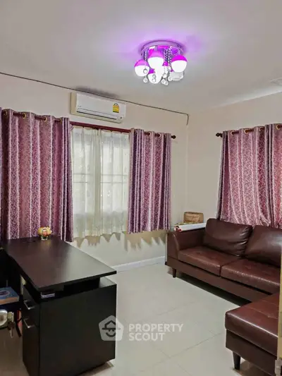 Cozy living room with leather sofa and elegant curtains