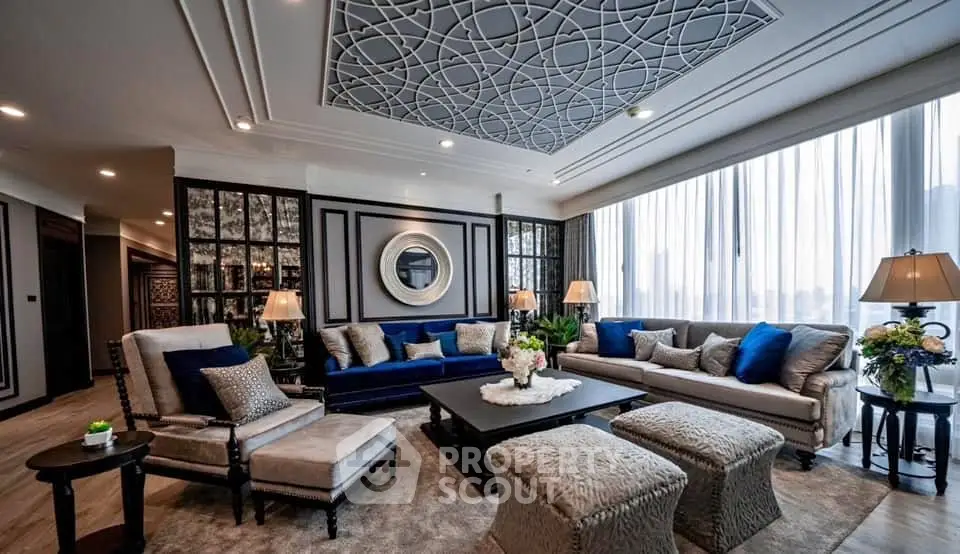Luxurious living room with elegant decor and large windows offering natural light.