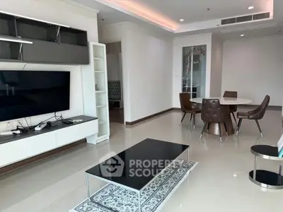 Spacious modern living room with sleek furniture and dining area, perfect for contemporary living.