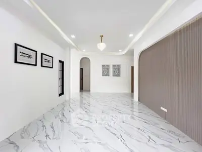 Elegant modern living room with marble flooring and stylish decor