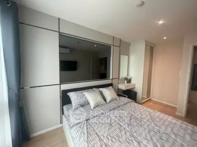 Modern bedroom with stylish decor and natural light