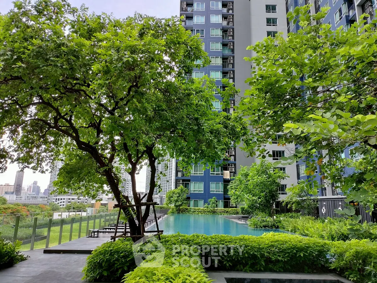 Luxurious urban apartment with lush garden and poolside view, perfect for relaxation and city living.