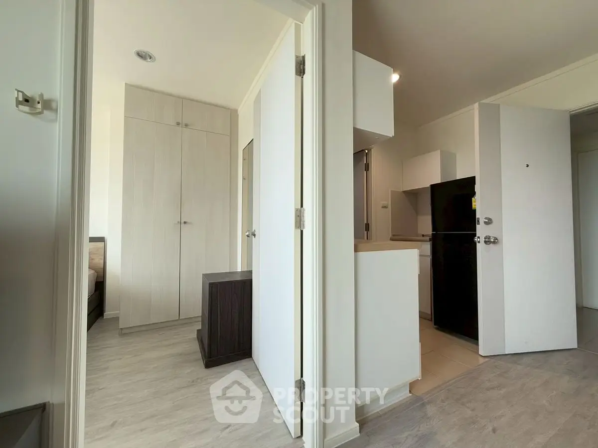 Modern apartment interior with open layout and sleek kitchen design