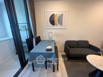 Modern living room with stylish decor and balcony access