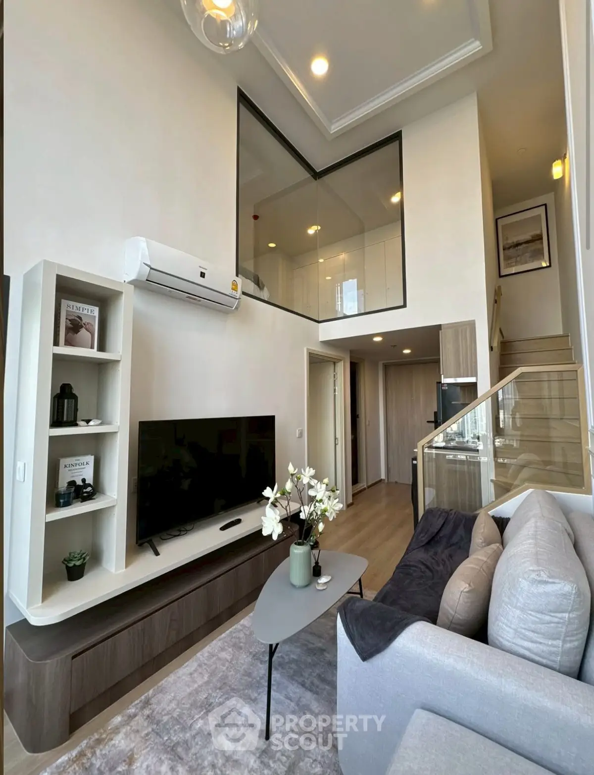 Modern living room with high ceiling and stylish decor