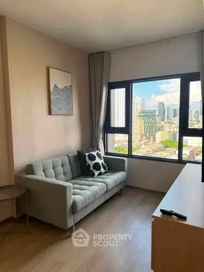 Modern living room with city view, featuring a stylish sofa and large window.