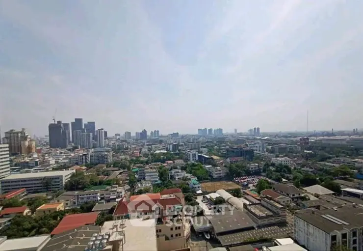 Stunning cityscape view from high-rise building showcasing urban skyline and distant horizon.