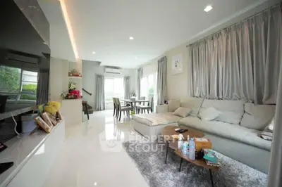 Spacious modern living room with elegant decor and ample natural light