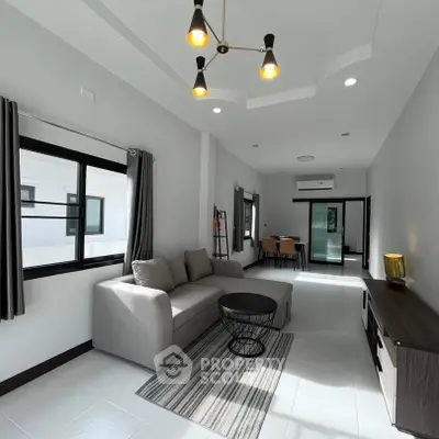 Modern living room with sleek furniture and natural light