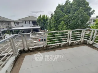 Spacious balcony with scenic neighborhood view and lush greenery