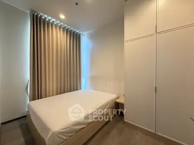 Modern bedroom with sleek design and ample storage space