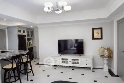 Modern living room with elegant decor and open kitchen layout