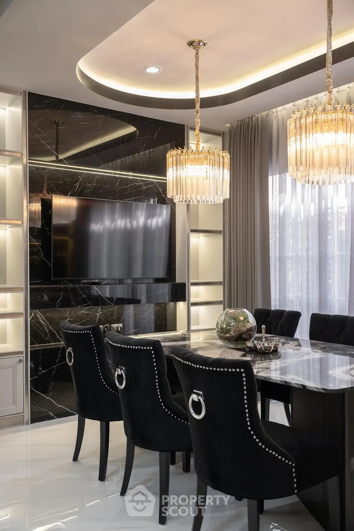Luxurious dining room with elegant chandeliers and modern decor