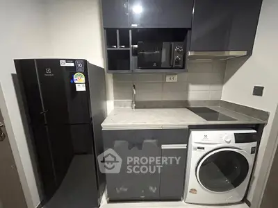 Modern compact kitchen with sleek appliances and efficient layout