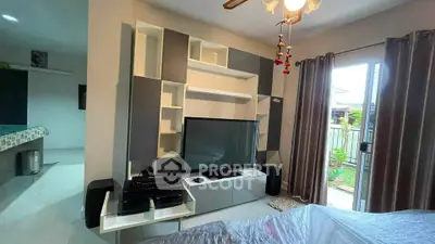 Modern living room with sleek entertainment center and garden view