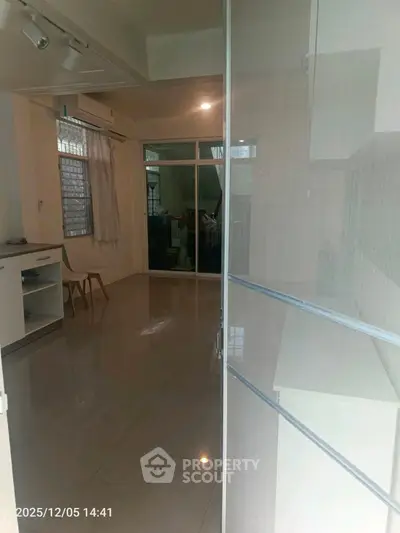 Spacious interior with modern design and ample natural light, featuring sleek flooring and contemporary furnishings.