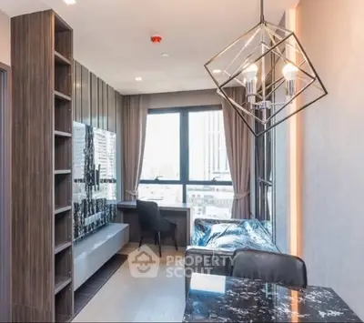 Modern living room with stylish lighting and city view, featuring sleek furniture and floor-to-ceiling window.