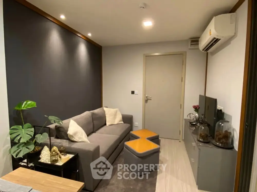 Modern living room with stylish decor and air conditioning