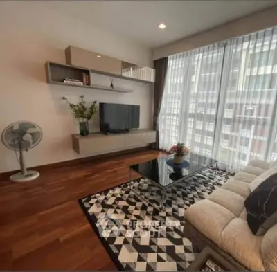 Stylish living room with modern decor and large window view