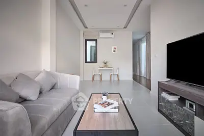 Modern living room with sleek furniture and neutral tones