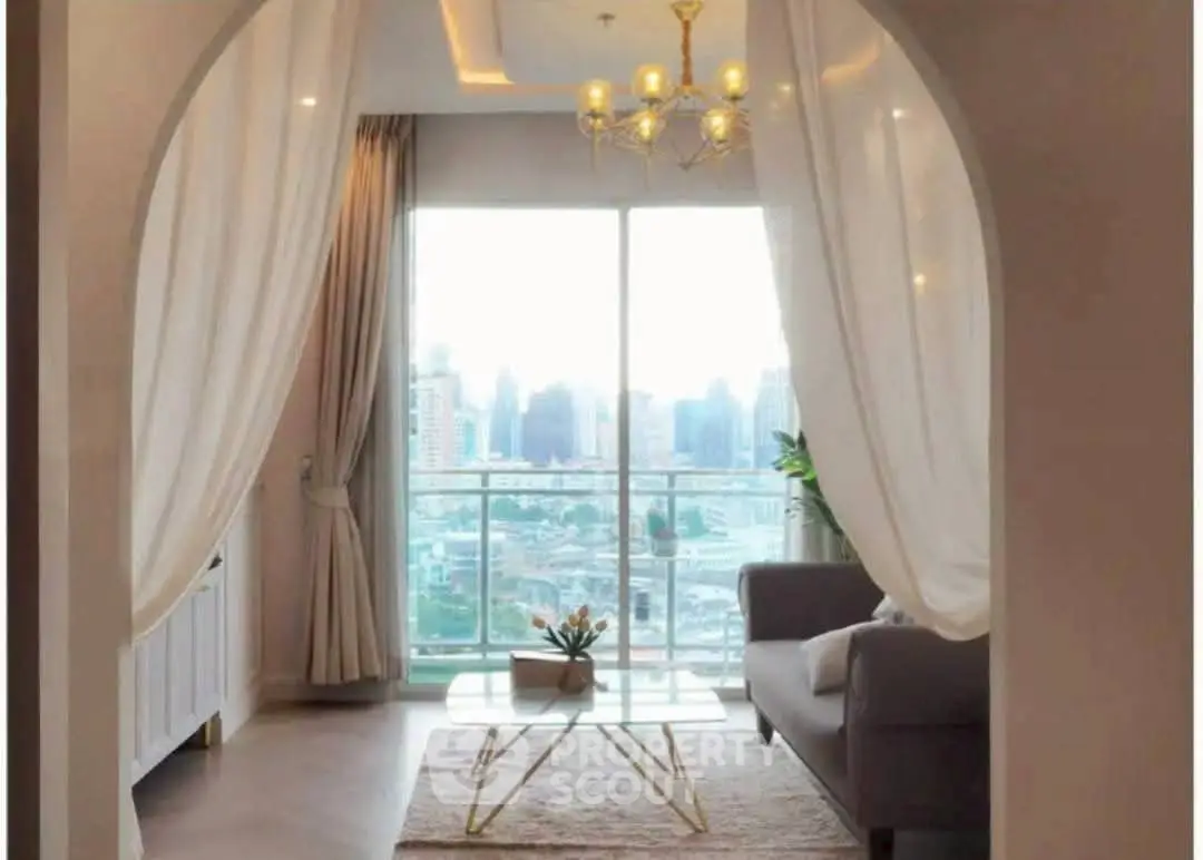 Elegant living room with city view, stylish chandelier, and cozy seating area.