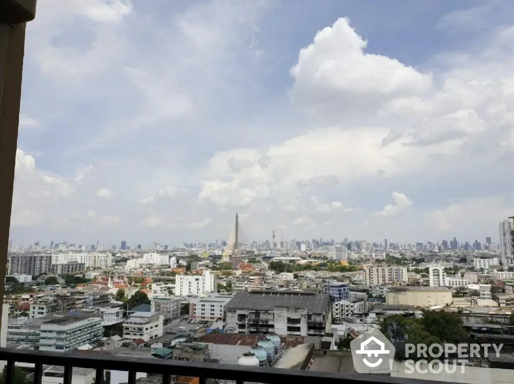 Stunning cityscape view from a high-rise balcony showcasing urban skyline and vibrant city life.