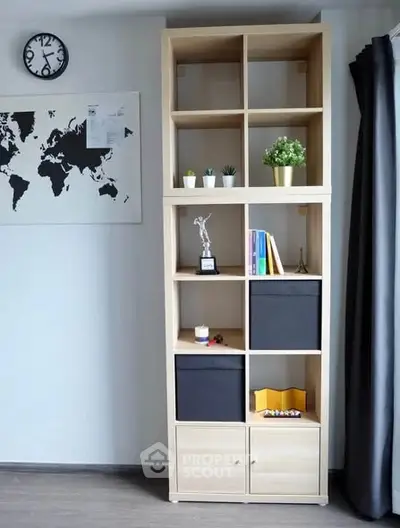 Modern living room with stylish shelving unit and world map decor