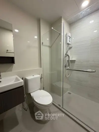 Modern bathroom with glass shower and sleek fixtures