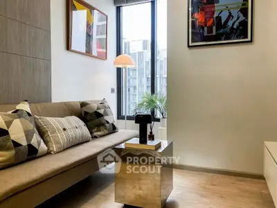 Modern living room with stylish decor and large window view