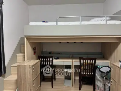 Modern loft-style bedroom with built-in desk and storage, perfect for maximizing space in small apartments.