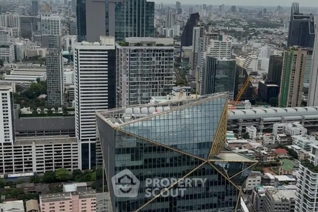 Stunning aerial view of modern cityscape with iconic skyscraper architecture.