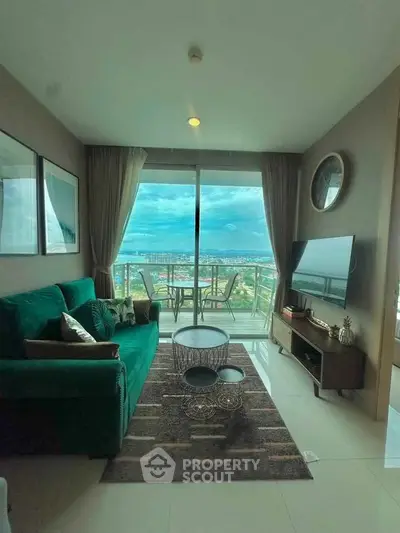 Modern living room with stunning city view and balcony access