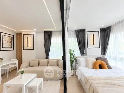 Modern studio apartment with cozy living area and stylish bedroom
