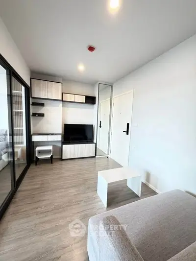 Modern living room with sleek furniture and wooden flooring