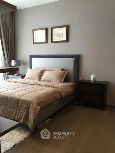 Elegant bedroom with modern decor and cozy bedding in a stylish apartment