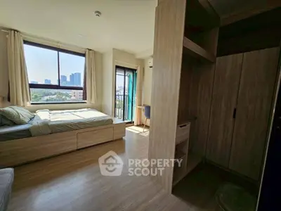 Bright bedroom with city view and modern wooden furniture
