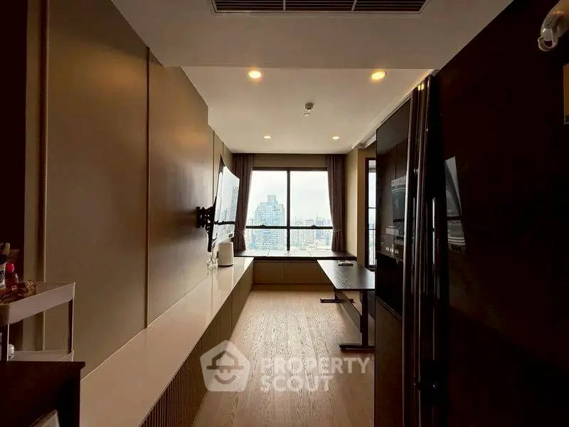 Modern living room with city view, sleek design, and ample natural light.